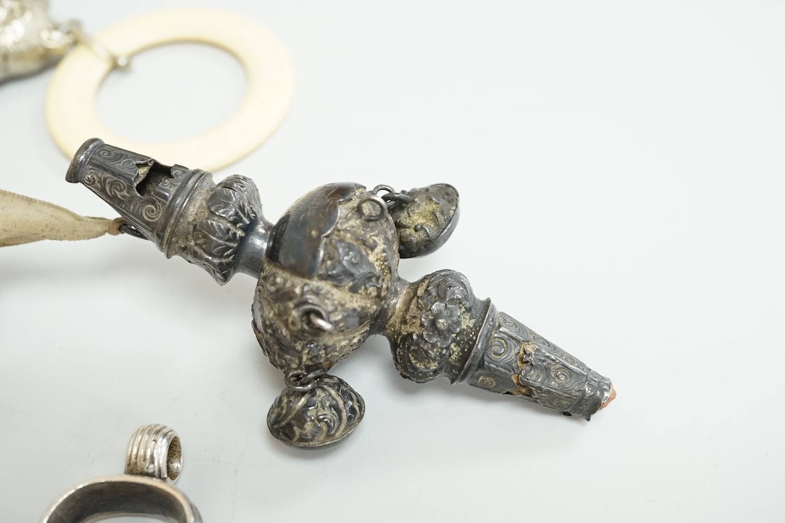 A George V silver circular vesta case, S. Blanckensee & Son Ltd, Birmingham, 43mm, together with a damaged silver child's rattle by George Unite, a cat child's rattle, white metal and lapis lazuli set fob, etc.